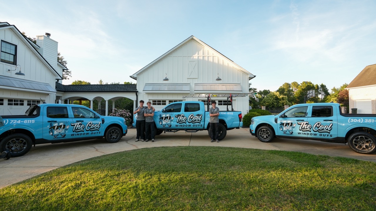 The Cool Window Guys team and trucks